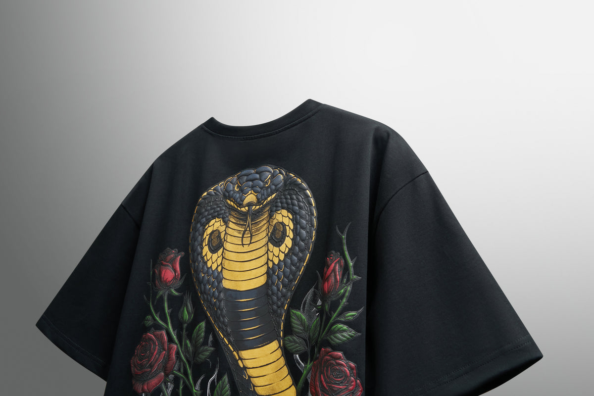 GRITMONK VENOM black oversized tee: angled back view, cobra print