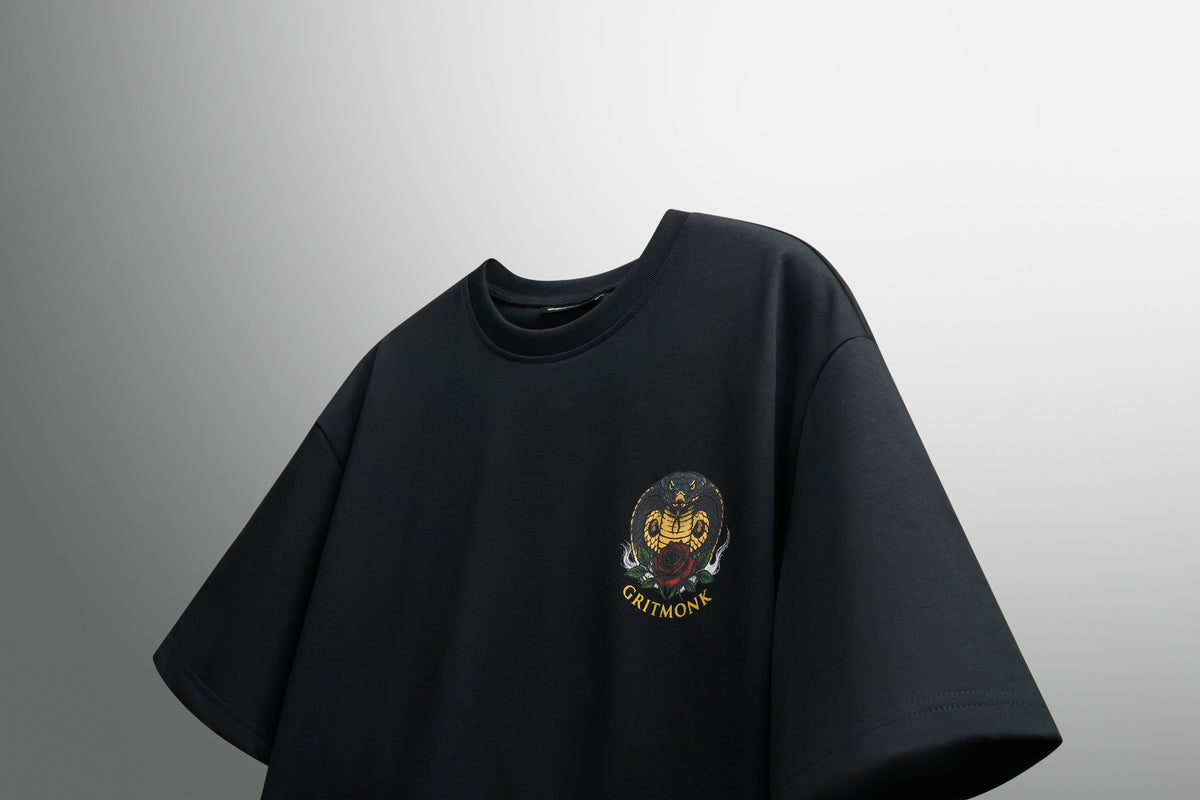 GRITMONK VENOM black oversized tee: angled front view, chest emblem