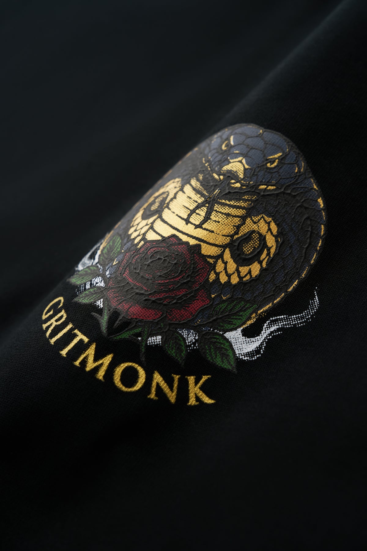 GRITMONK VENOM black oversized tee: close-up of the chest emblem